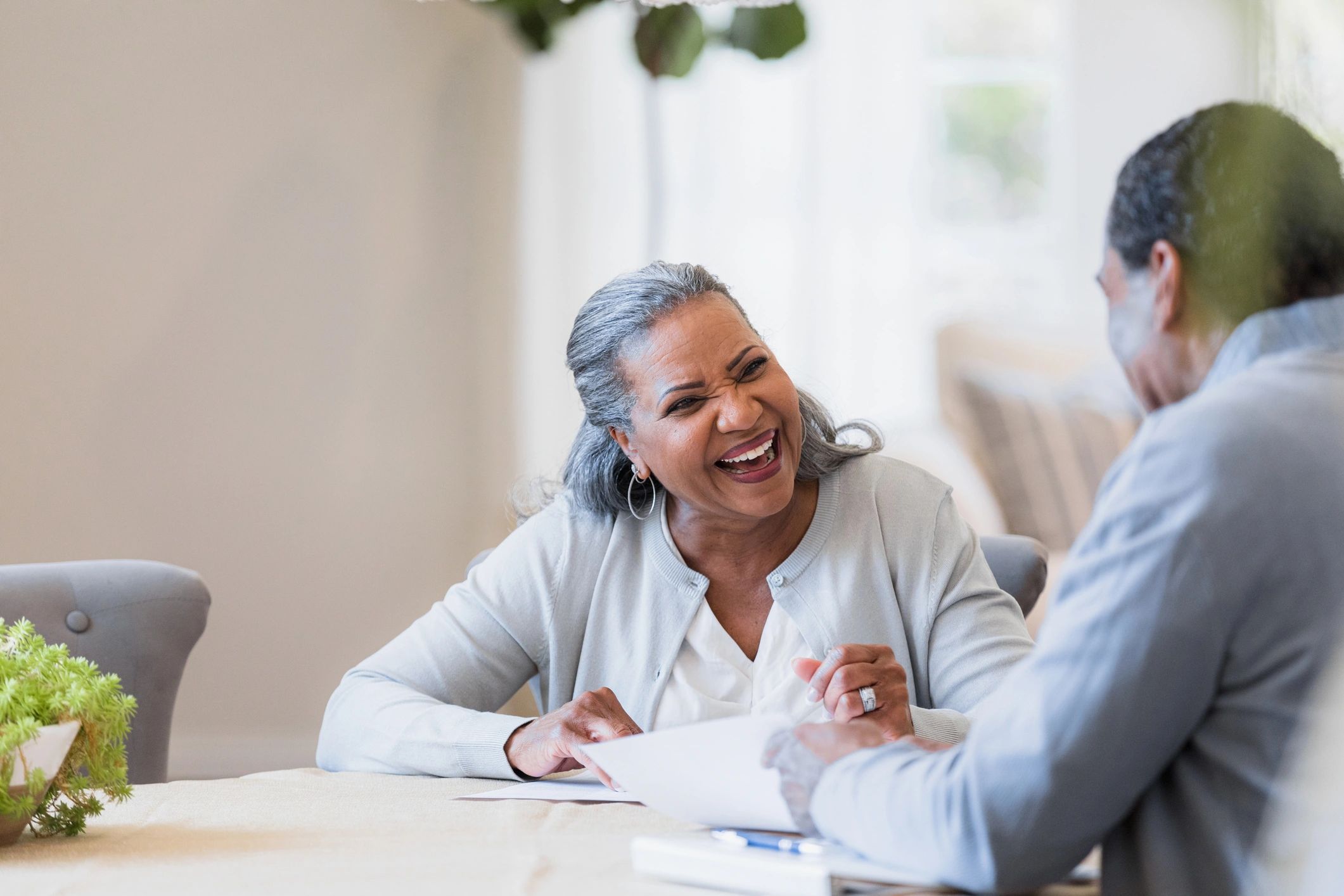 Mature couple talking at a table