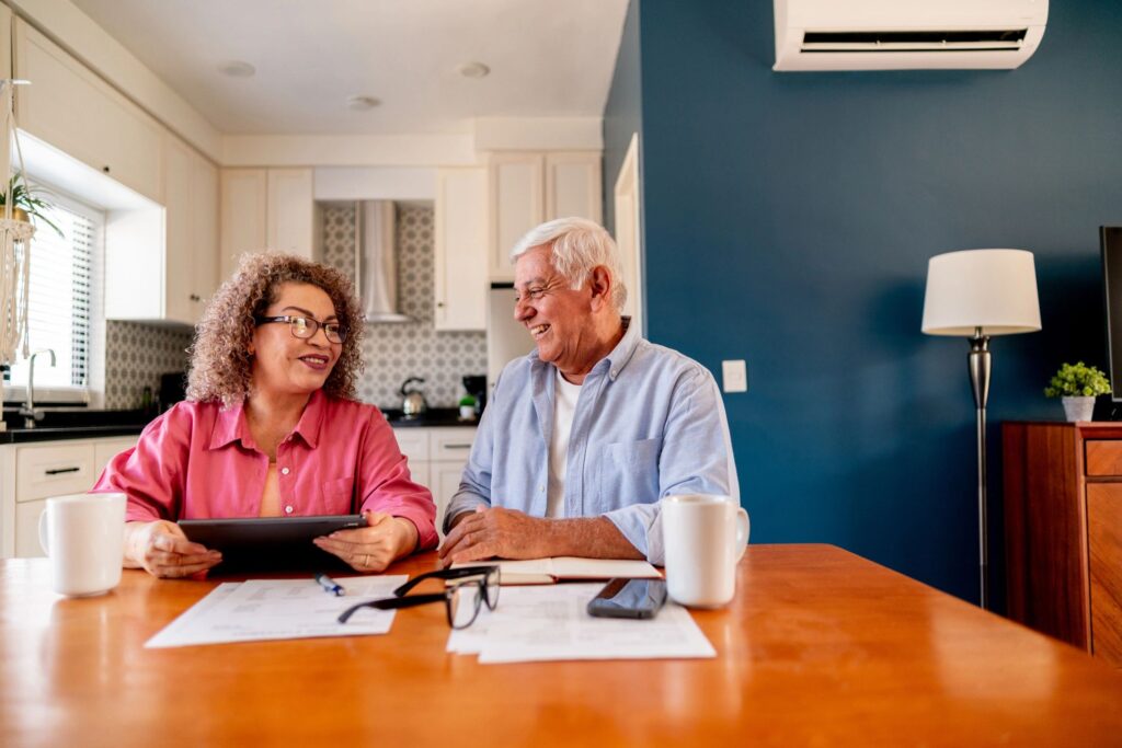 Senior couple talking and doing home finance